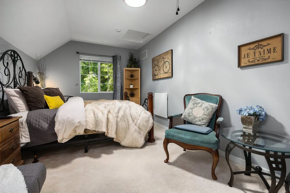 The Baker suite at The Grayson, with a vaulted ceiling and a reading chair