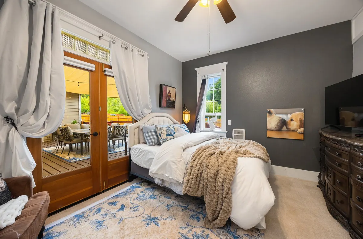 The Olympic suite at The Grayson, with French doors to the entertainment deck and the off-leash dog area